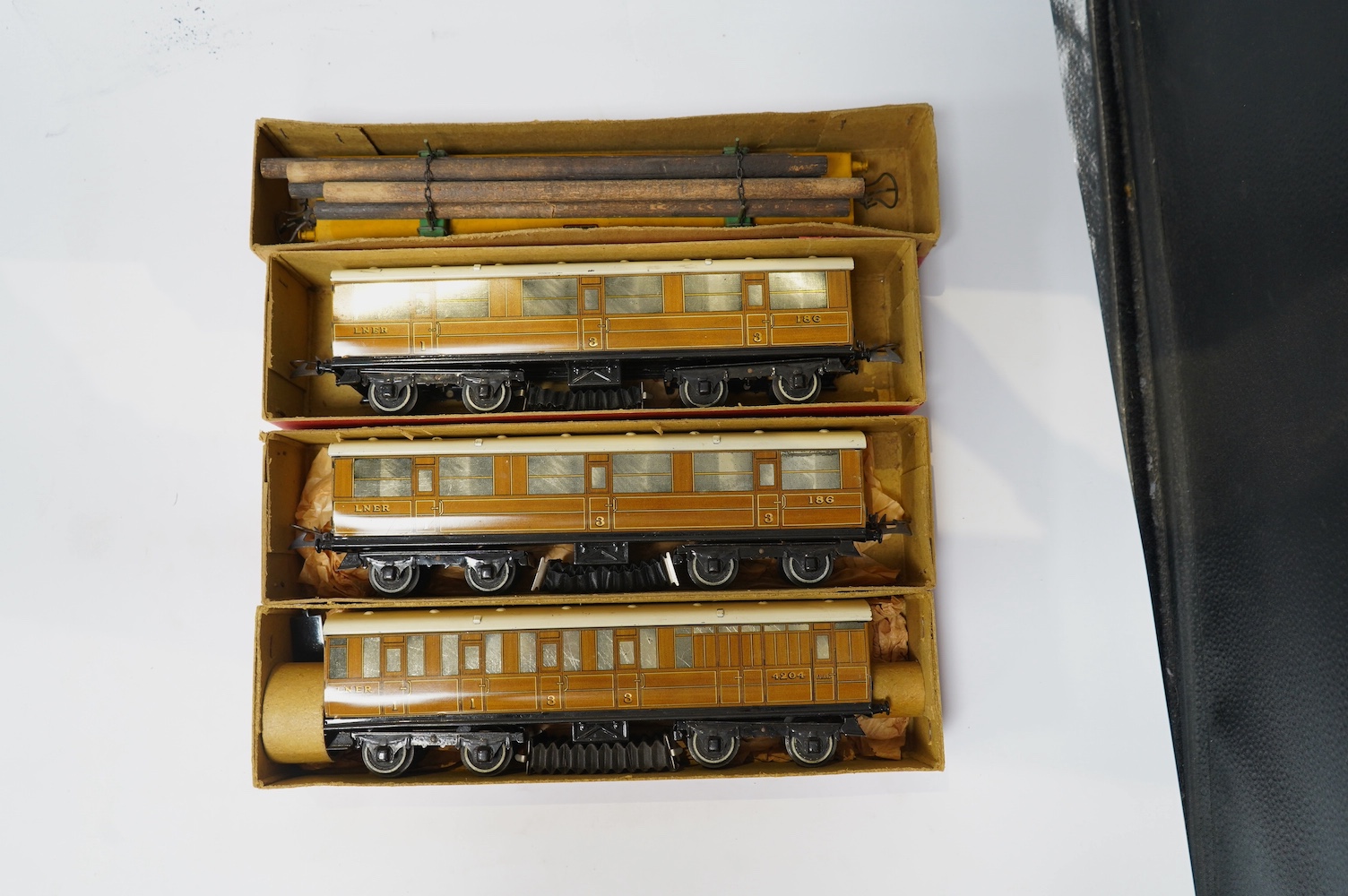 Twenty-four HO gauge model railway by Lima, Trix, Fleischmann, etc. including a German DB 4-6-2 tender locomotive, 10 001, fourteen Continental outline bogie coaches, 4-wheel coaches, and freight wagons. Condition - fair